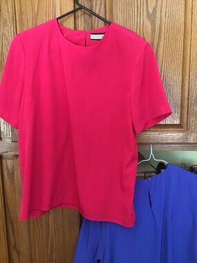 Two basic solid color 100% polyester shells. Size 10 Blue and Size 12 Fushcia